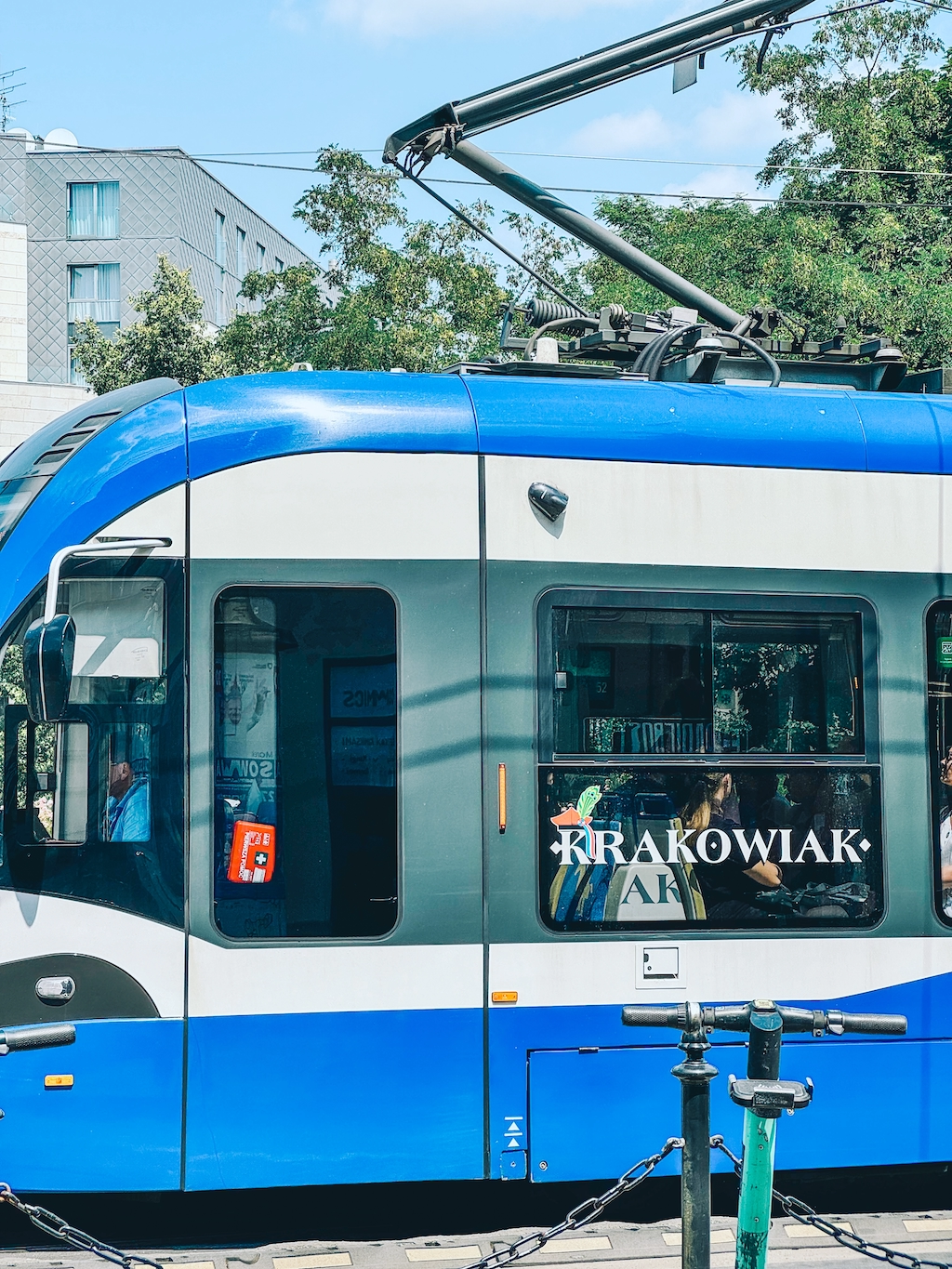 A blue tram labeled Krakowiak