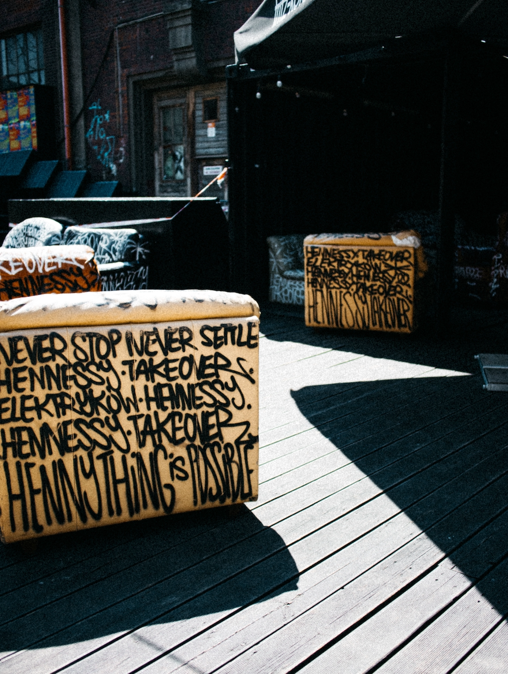 An armchair covered in graffiti