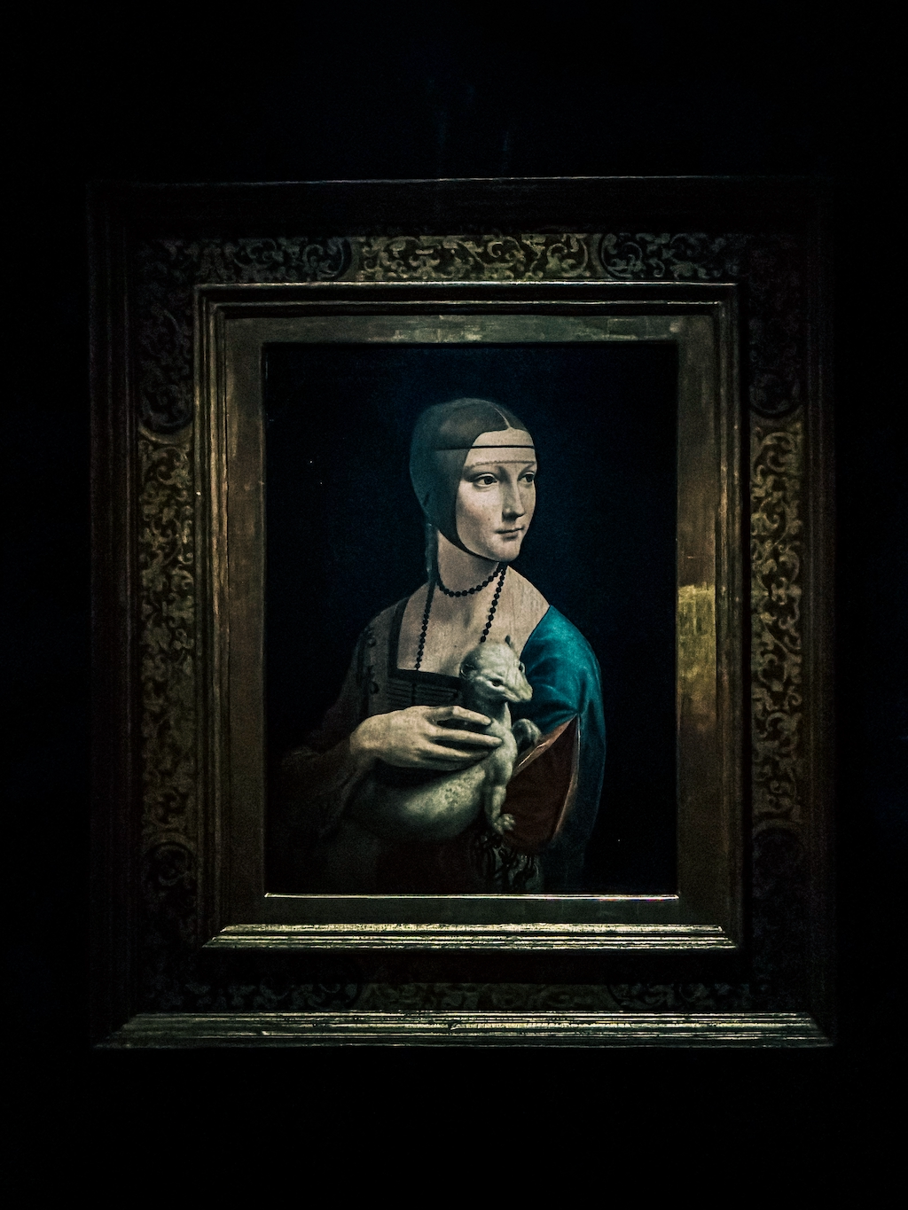 Lady with an Ermine in a gilt frame